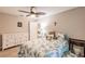 Bedroom with ceiling fan and white dresser at 3495 Levee St, North Port, FL 34288
