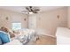 Bedroom with ceiling fan, and white dresser at 3495 Levee St, North Port, FL 34288