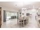 Open concept dining area with kitchen access at 3495 Levee St, North Port, FL 34288