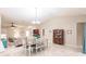 Open concept dining room with seating for six at 3495 Levee St, North Port, FL 34288