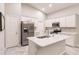 Modern kitchen with stainless steel appliances and white cabinets at 3495 Levee St, North Port, FL 34288