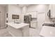 Island kitchen with stainless steel appliances and white cabinets at 3495 Levee St, North Port, FL 34288