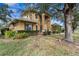 Two-story home with mature landscaping at 387 Hallcrest Ter, Port Charlotte, FL 33954