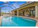 Resort-style screened pool and patio with comfortable seating at 387 Hallcrest Ter, Port Charlotte, FL 33954