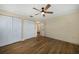 Light-filled bedroom with wood-look flooring and a ceiling fan at 4072 San Massimo Dr, Punta Gorda, FL 33950