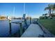 Private boat dock with lift, steps, and waterfront access at 4072 San Massimo Dr, Punta Gorda, FL 33950