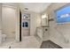 Spa-like bathroom with a large walk-in shower and marble tile at 4629 Enid Ln, North Port, FL 34288