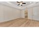 Large bedroom with ceiling fan and access to en-suite bathroom at 4629 Enid Ln, North Port, FL 34288