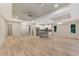Open living space with high ceilings, hardwood floors, and kitchen island at 4629 Enid Ln, North Port, FL 34288