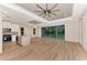 Spacious living area with large sliding glass doors and modern kitchen at 4629 Enid Ln, North Port, FL 34288