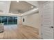 Open floor plan featuring hardwood floors and sliding glass doors leading to backyard at 4629 Enid Ln, North Port, FL 34288
