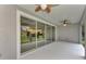 Spacious covered patio with sliding glass doors leading to the backyard at 4629 Enid Ln, North Port, FL 34288