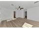 Spacious bedroom with ceiling fan and vinyl plank flooring at 5049 Birdsong St, North Port, FL 34291