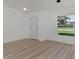 Simple dining room with vinyl plank flooring and a window at 5049 Birdsong St, North Port, FL 34291