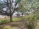 Backyard view with trees and road view at 5232 Palena Blvd, North Port, FL 34287