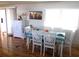 Dining area with white table and chairs, and hardwood floors at 5232 Palena Blvd, North Port, FL 34287