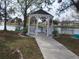 White gazebo with benches overlooking a pond at 5232 Palena Blvd, North Port, FL 34287