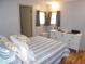 Main bedroom with striped bedding, dresser, and hardwood floors at 5232 Palena Blvd, North Port, FL 34287