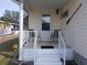 Mobile home side porch with seating and metal railings at 5232 Palena Blvd, North Port, FL 34287