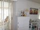 White storage cabinet with decorative items on top at 5232 Palena Blvd, North Port, FL 34287