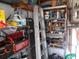 Organized storage room with shelves and tools at 5232 Palena Blvd, North Port, FL 34287