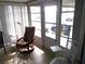 Relaxing sunroom with comfy chair and access to outdoors at 5232 Palena Blvd, North Port, FL 34287