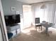 Bright sunroom with tiled floor, seating area, and large windows at 5232 Palena Blvd, North Port, FL 34287