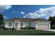 Single-story home with attached garage and landscaping at 5394 Sturrup St, North Port, FL 34291