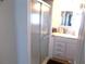 Bathroom features a shower and white vanity at 5733 Holiday Park Blvd, North Port, FL 34287