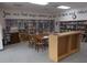 Community library with bookshelves, tables, and games at 5733 Holiday Park Blvd, North Port, FL 34287