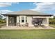 Spacious backyard showcasing the home's exterior and landscaping at 102 Linda Lee Dr, Rotonda West, FL 33947