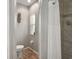 Small bathroom with toilet and shower stall at 102 Linda Lee Dr, Rotonda West, FL 33947