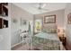 Bedroom with a full-size bed and built-in shelves at 102 Linda Lee Dr, Rotonda West, FL 33947