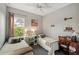Two twin beds, a desk, and window with natural light at 102 Linda Lee Dr, Rotonda West, FL 33947
