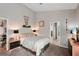 Main bedroom with a large bed and ensuite bathroom at 102 Linda Lee Dr, Rotonda West, FL 33947