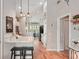 Open concept kitchen with breakfast bar and stylish pendant lighting at 102 Linda Lee Dr, Rotonda West, FL 33947