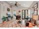 Living room with hardwood floors, fireplace, and large windows at 102 Linda Lee Dr, Rotonda West, FL 33947
