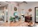 Spacious living room with hardwood floors, fireplace, and large windows at 102 Linda Lee Dr, Rotonda West, FL 33947
