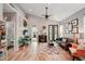 Spacious living room with hardwood floors, a fireplace, and lots of natural light at 102 Linda Lee Dr, Rotonda West, FL 33947