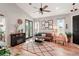 Bright living room with hardwood floors and a cozy seating area at 102 Linda Lee Dr, Rotonda West, FL 33947