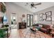 Living area with hardwood floors, a fireplace, and French doors at 102 Linda Lee Dr, Rotonda West, FL 33947