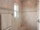 Clean shower with tile surround and corner seat at 102 Linda Lee Dr, Rotonda West, FL 33947