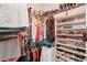 Large walk-in closet with ample shelving and hanging space at 102 Linda Lee Dr, Rotonda West, FL 33947