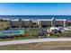 Aerial view of waterfront community with tennis courts and resort-style amenities at 101 N Marion Ct # 131, Punta Gorda, FL 33950