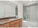 Bathroom with granite vanity and shower/tub combo at 101 N Marion Ct # 131, Punta Gorda, FL 33950