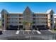 Three-story building with parking and landscaping at 101 N Marion Ct # 131, Punta Gorda, FL 33950