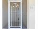 White front door with screen door and unit number 131 at 101 N Marion Ct # 131, Punta Gorda, FL 33950