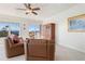 Living area featuring leather furniture and balcony access at 101 N Marion Ct # 131, Punta Gorda, FL 33950