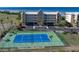 Blue tennis court with green perimeter fencing at 101 N Marion Ct # 131, Punta Gorda, FL 33950