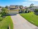 Aerial view of the house, showcasing the driveway and yard at 1020 Caliva St, North Port, FL 34286